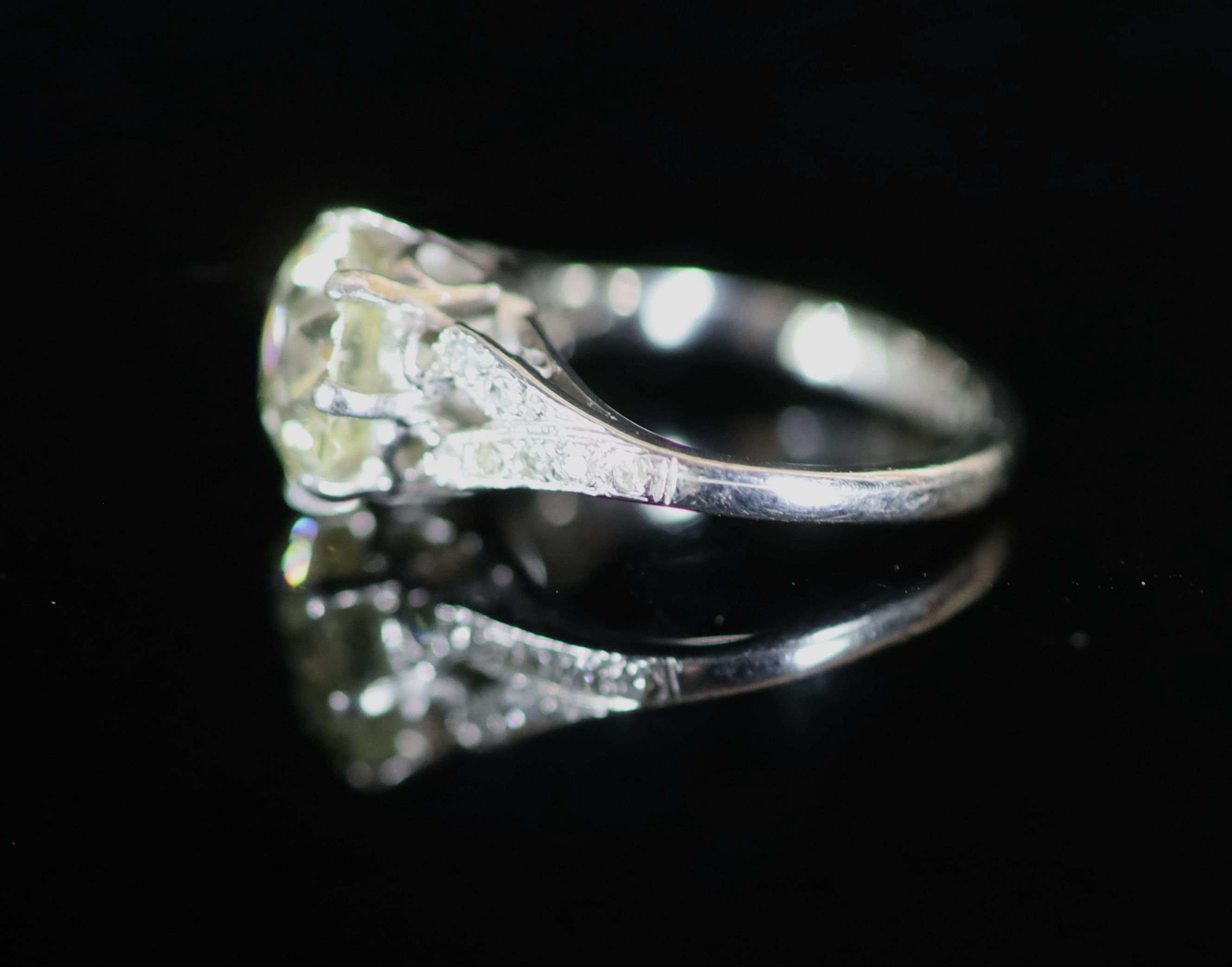 A 20th century 18ct white gold and platinum set single stone diamond ring, with diamond set shoulders